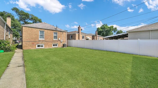 a view of a house with a back yard