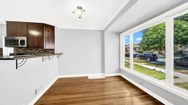 a view of a living room and floor to ceiling window