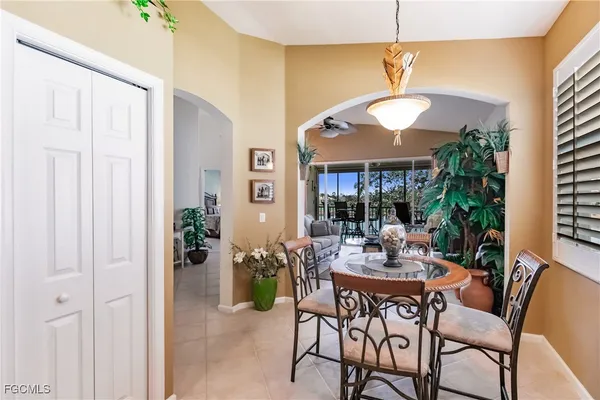 a view of a dining room with furniture window and outside view