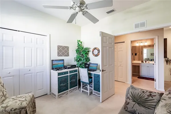 a view of a livingroom with furniture and windows