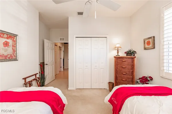 a bedroom with a bed and a closet