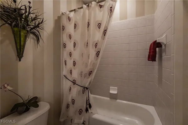 a bathroom with a bathtub and shower