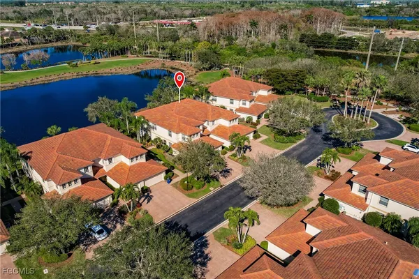 an aerial view of a house with a lake view