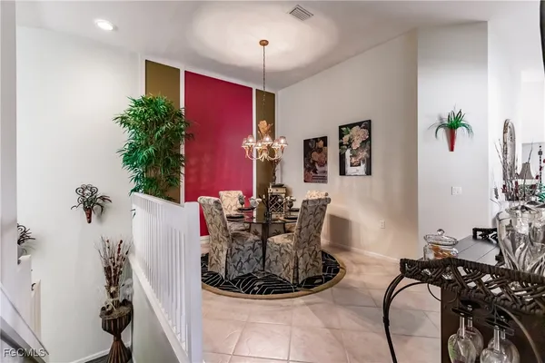 a view of a livingroom with furniture and potted plants