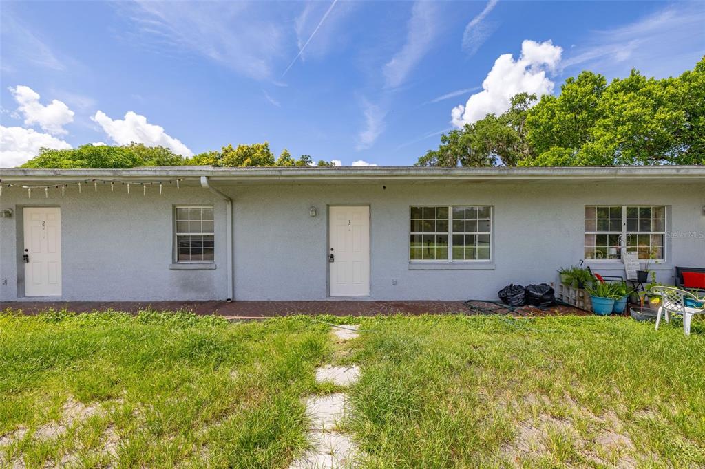 2150 Barbara Drive, Unit 2 St. Cloud, FL 34771 - Photo 3 of 9 front view of house with a yard