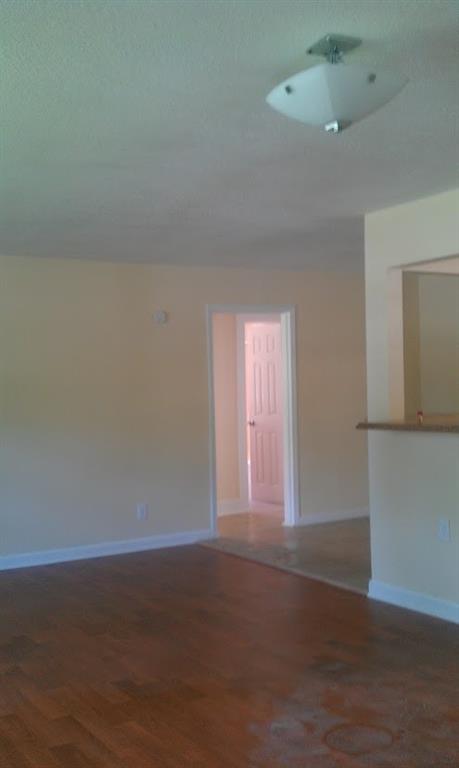 55 Cochran Road Southeast Marietta, GA 30060 - Photo 14 of 20 a view of an empty room with wooden floor and a window