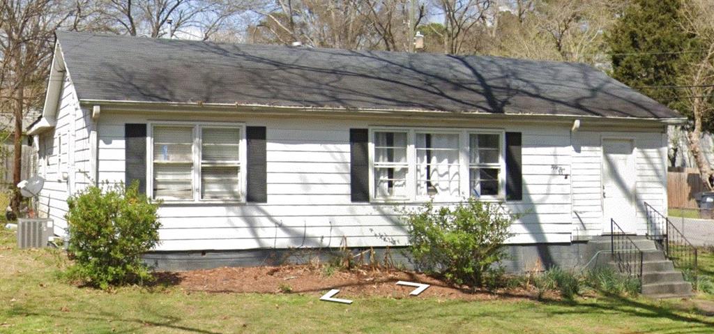 55 Cochran Road Southeast Marietta, GA 30060 - Photo 3 of 20 a front view of a house with garden