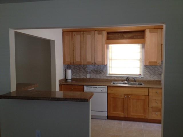 55 Cochran Road Southeast Marietta, GA 30060 - Photo 6 of 20 a kitchen with stainless steel appliances granite countertop a sink a stove and a microwave