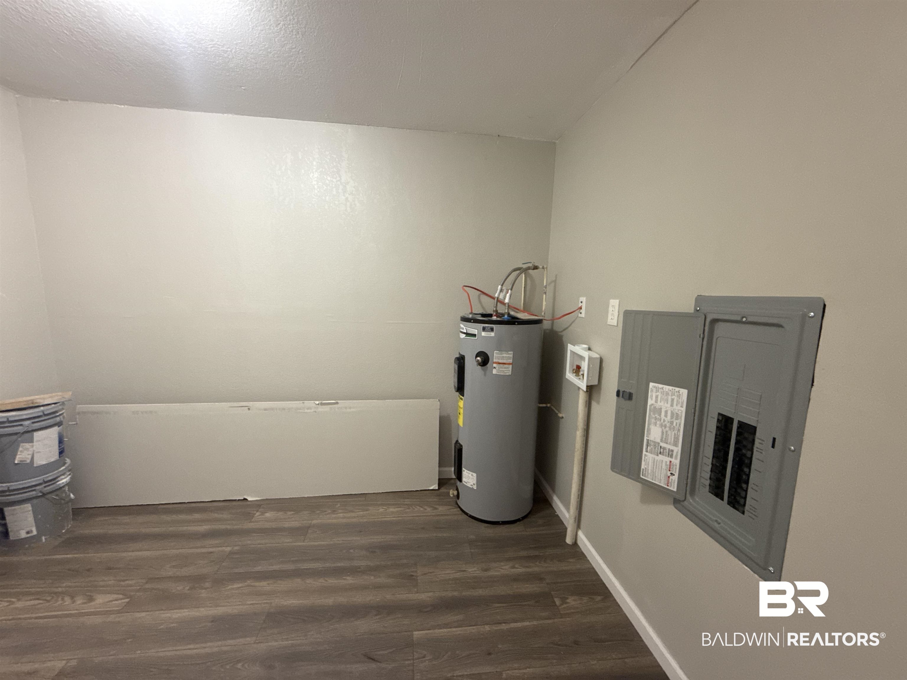 32 Slate Street Atmore, AL 36502 - Photo 7 of 16 Utilities featuring electric panel and electric water heater