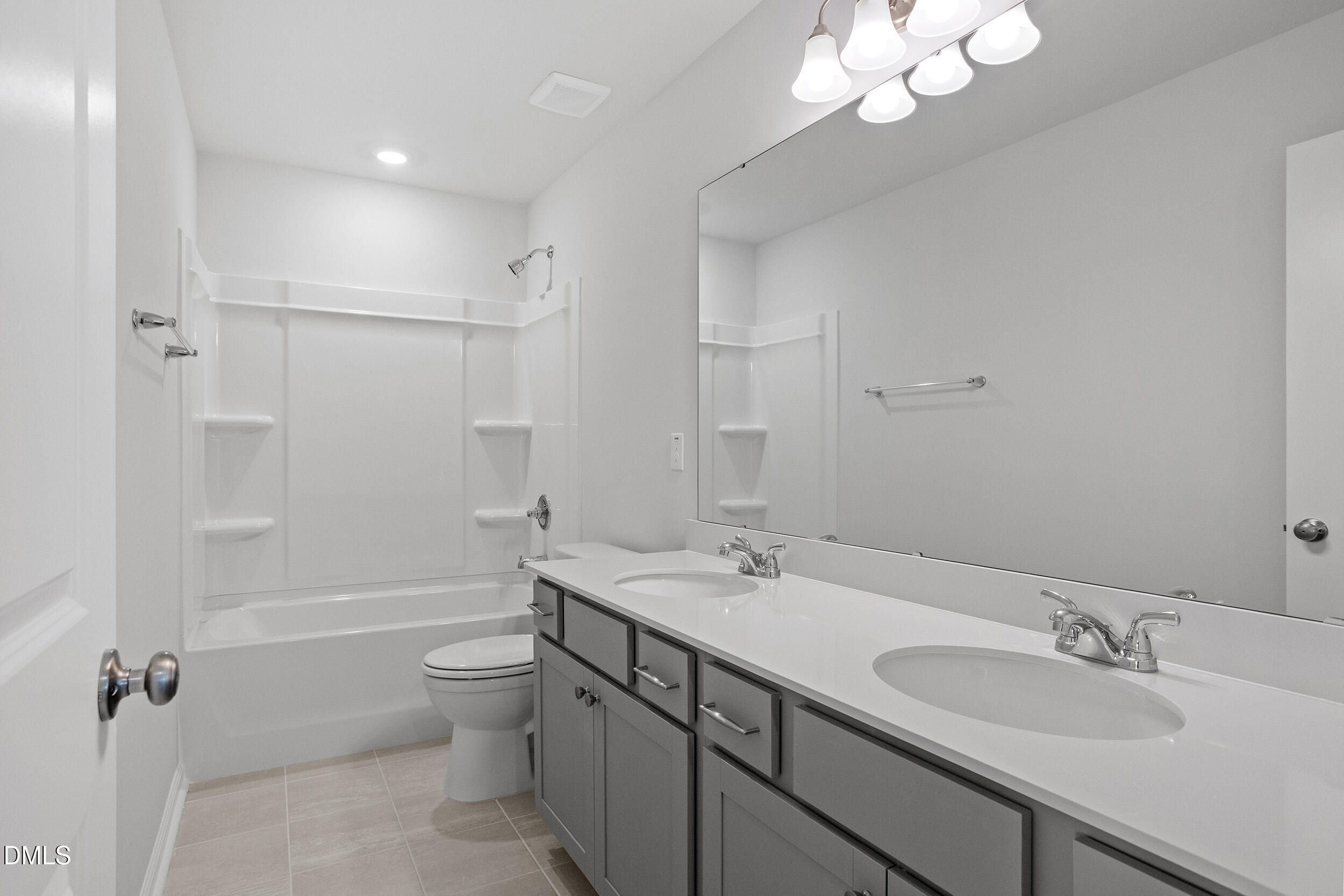 79 Osgood Street Angier, NC 27501 - Photo 29 of 31 a bathroom with a double vanity sink mirror and toilet