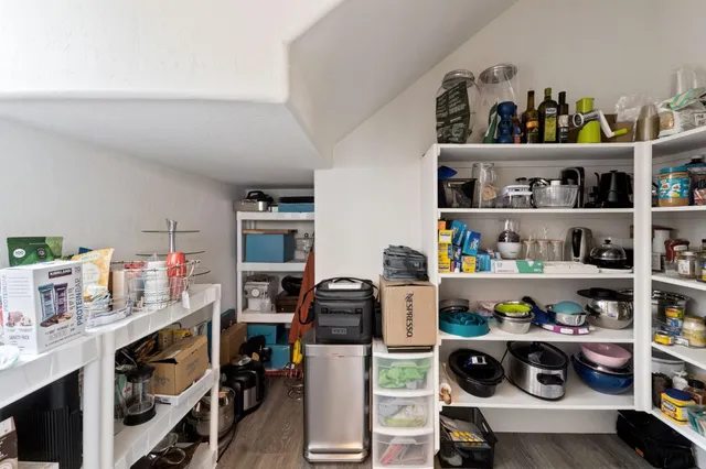 a view of workspace with lots of clutter and clutter