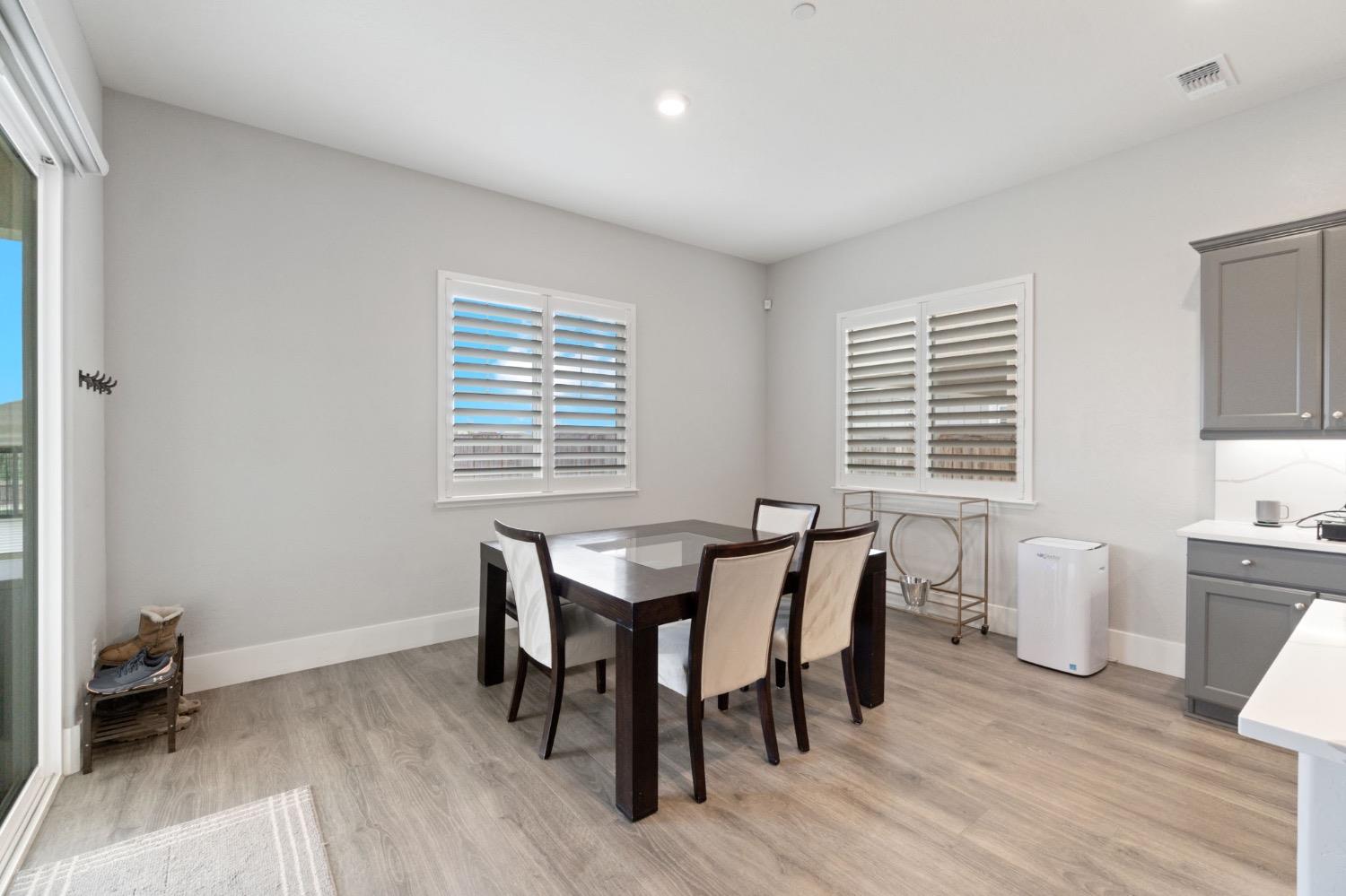 4491 Vineyard Drive Madera, CA 93636 - Photo 16 of 47 a view of a dining room with furniture and wooden floor