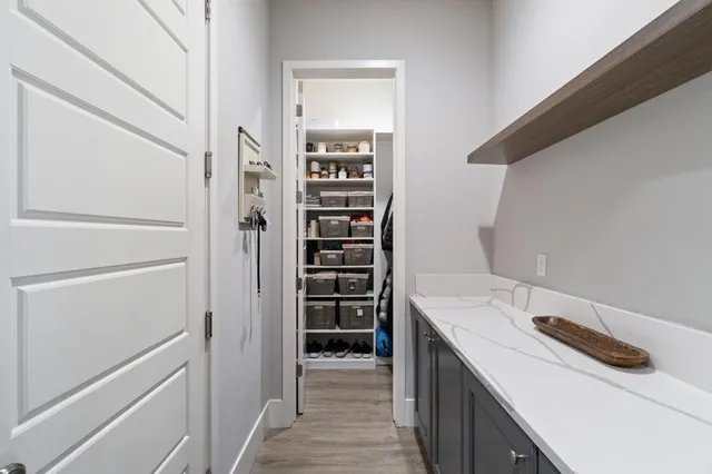 a view of walk in closet and bedroom