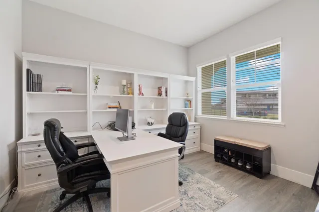 a work room with furniture and a window