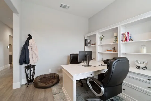 a view of a workspace with furniture and toys