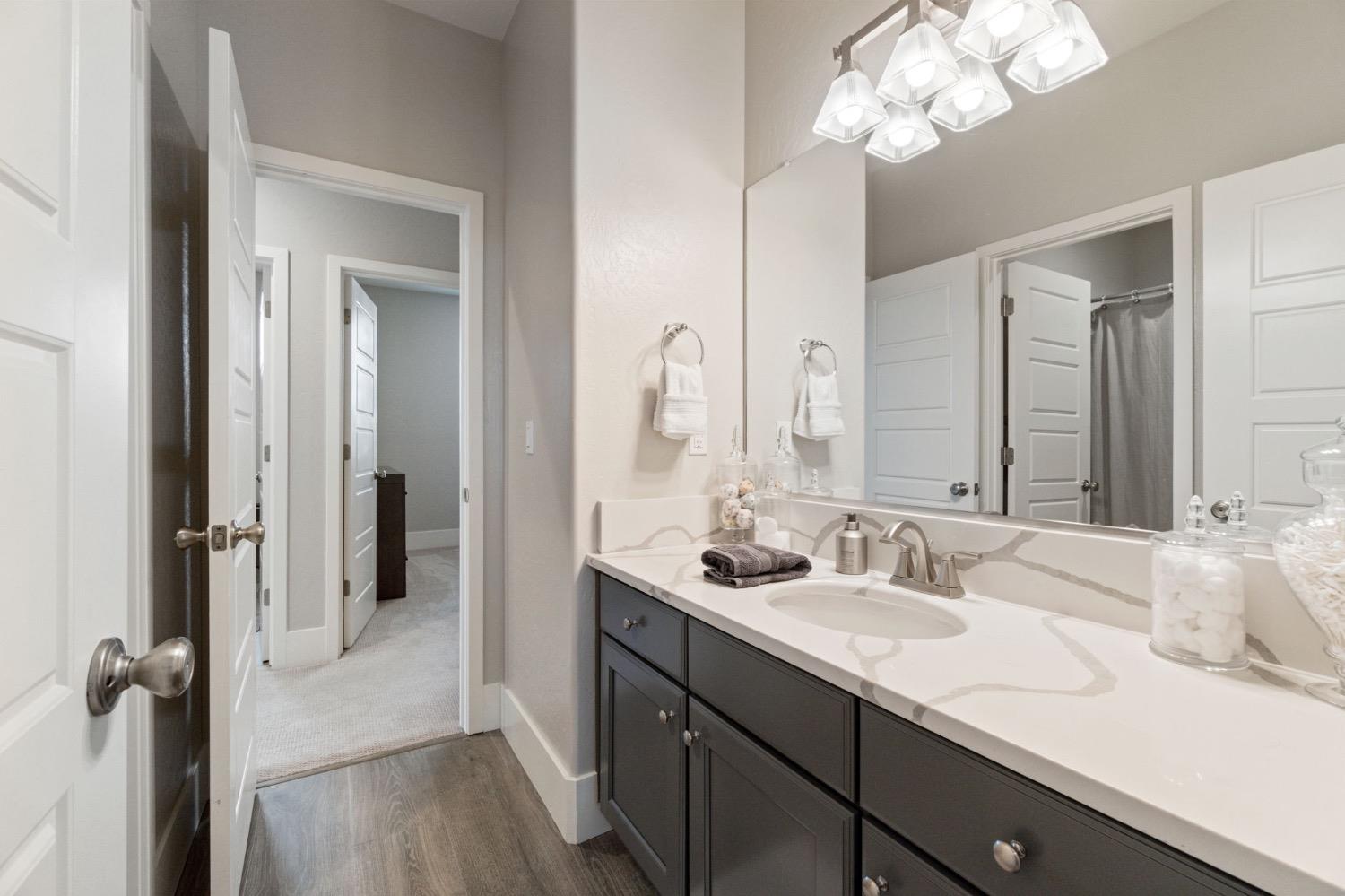4491 Vineyard Drive Madera, CA 93636 - Photo 27 of 47 a bathroom with a sink double vanity and a mirror