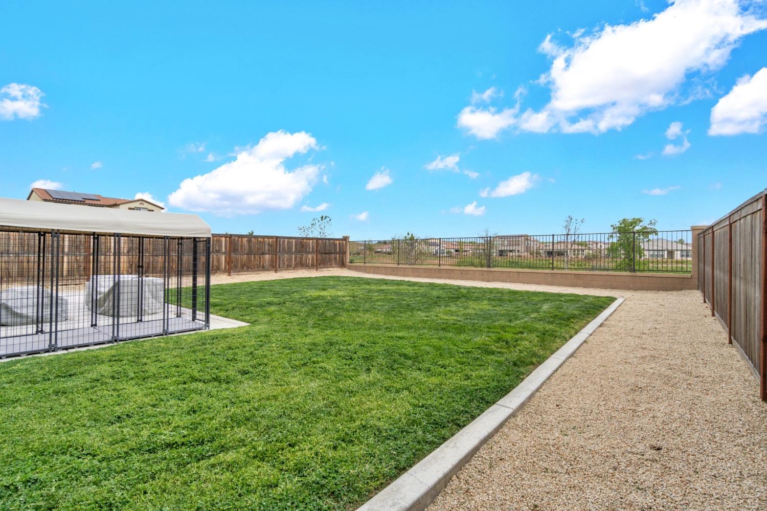 4491 Vineyard Drive Madera, CA 93636 - Photo 36 of 47 a view of a garden with a slide