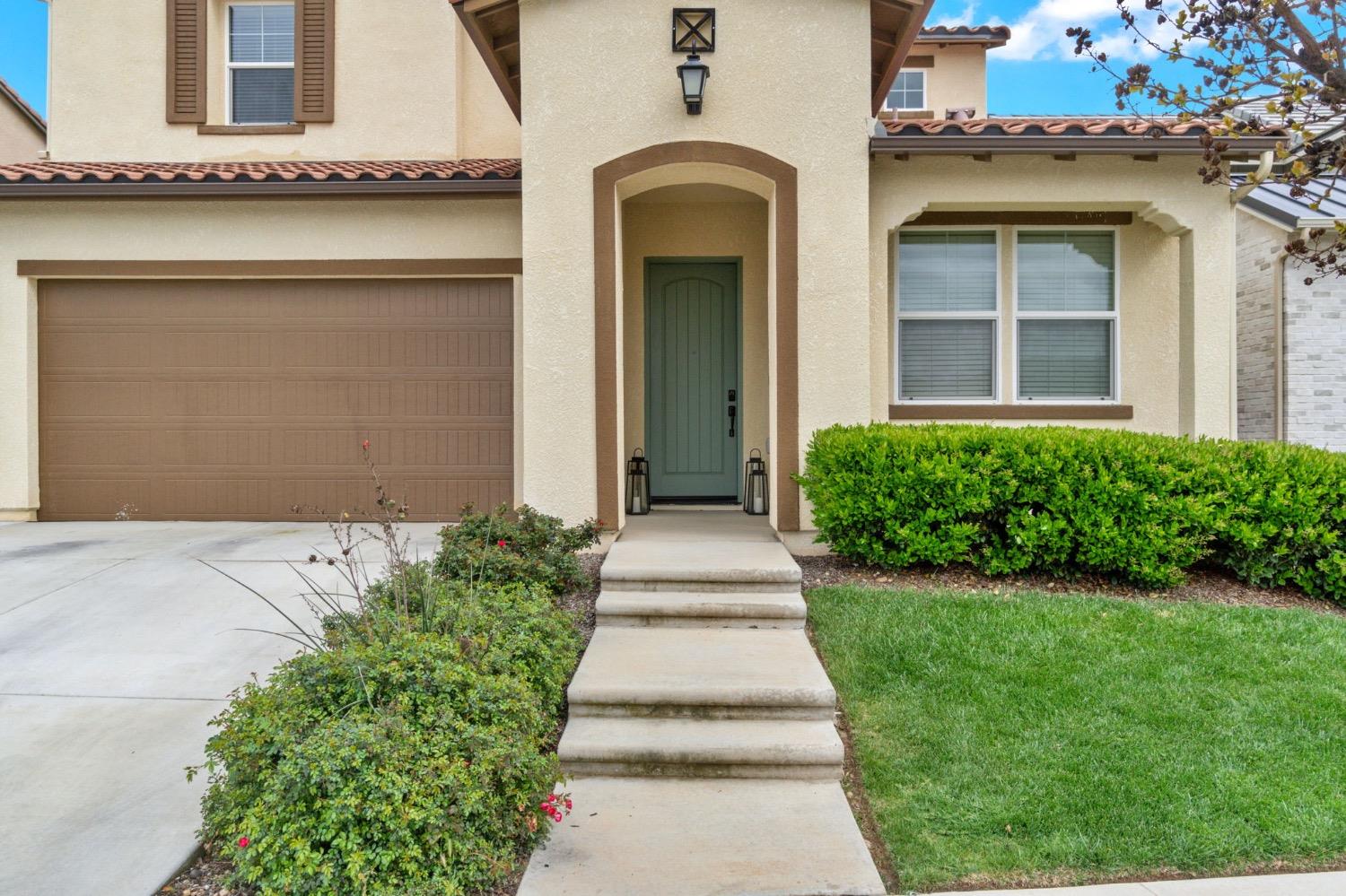 4491 Vineyard Drive Madera, CA 93636 - Photo 4 of 47 a front view of a house with a yard