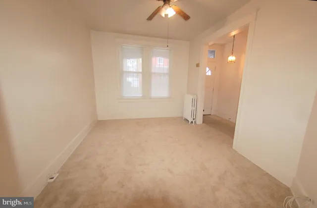 an empty room with a empty space and a window