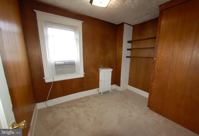 a view of an empty room with windows