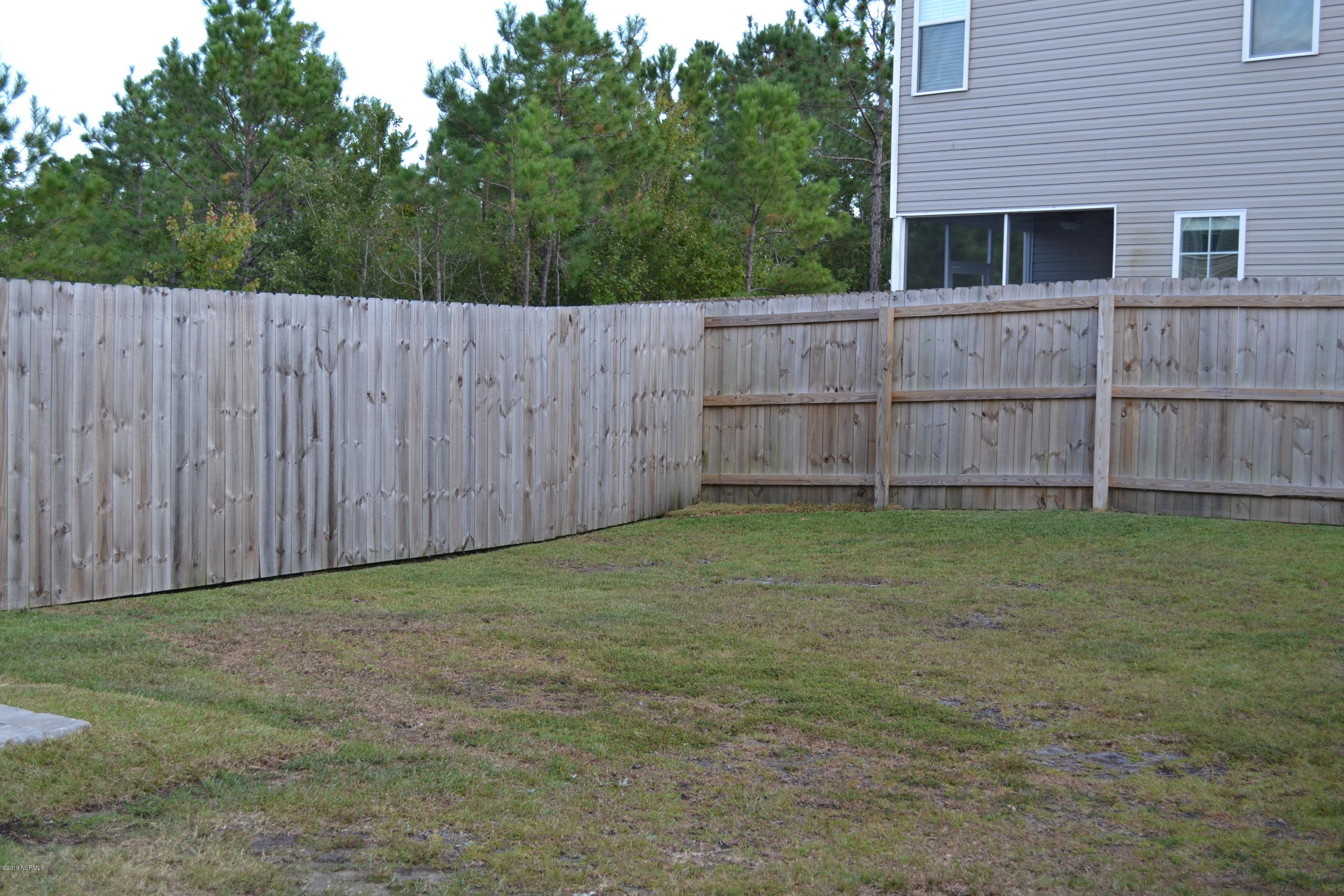300 Frisco Way Holly Ridge, NC 28445 - Photo 31 of 37 Large back yard with privacy fence