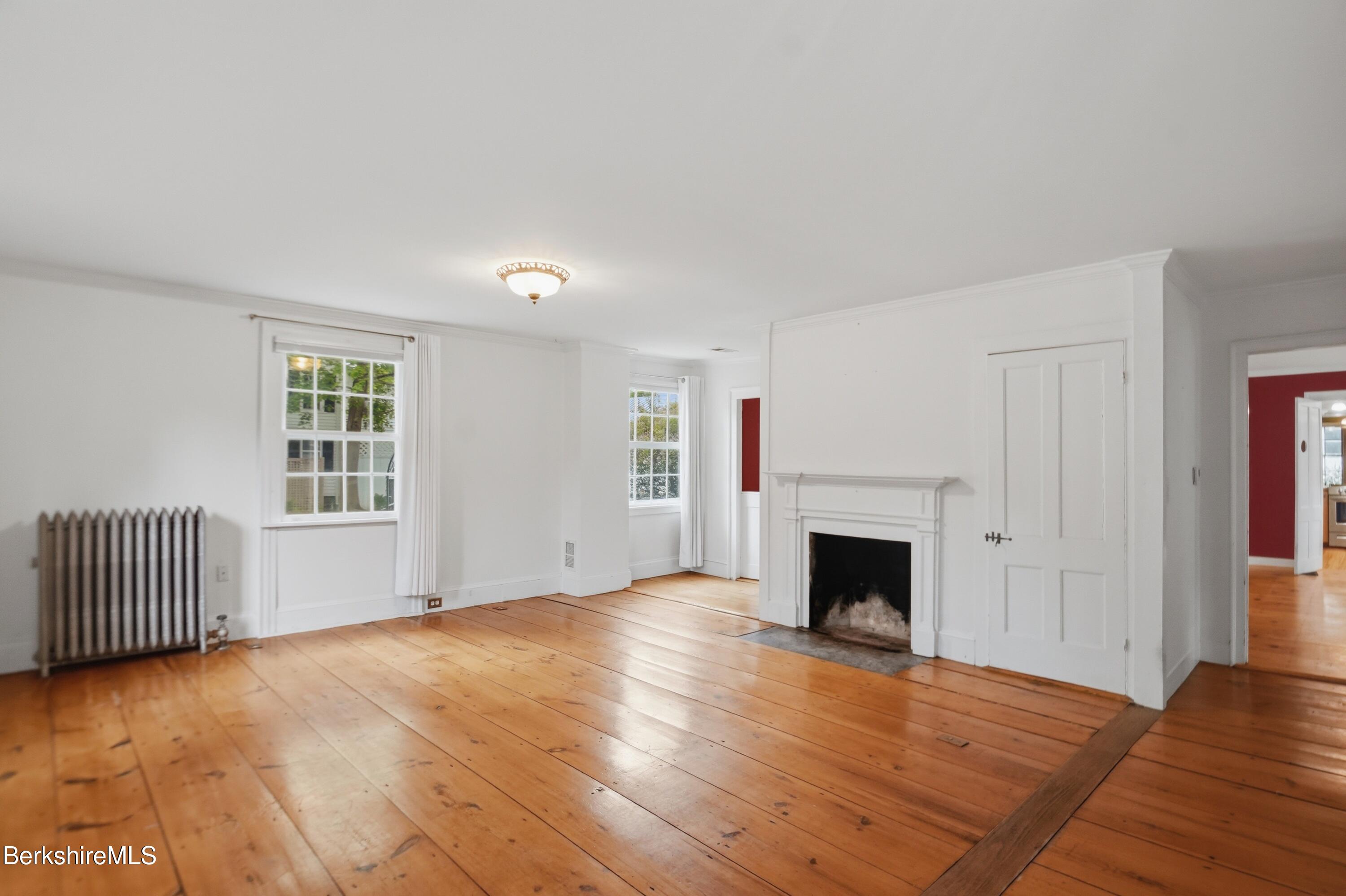4 Stockbridge Road West Stockbridge, MA 01266 - Photo 18 of 94 wooden floor fireplace and windows in an empty room