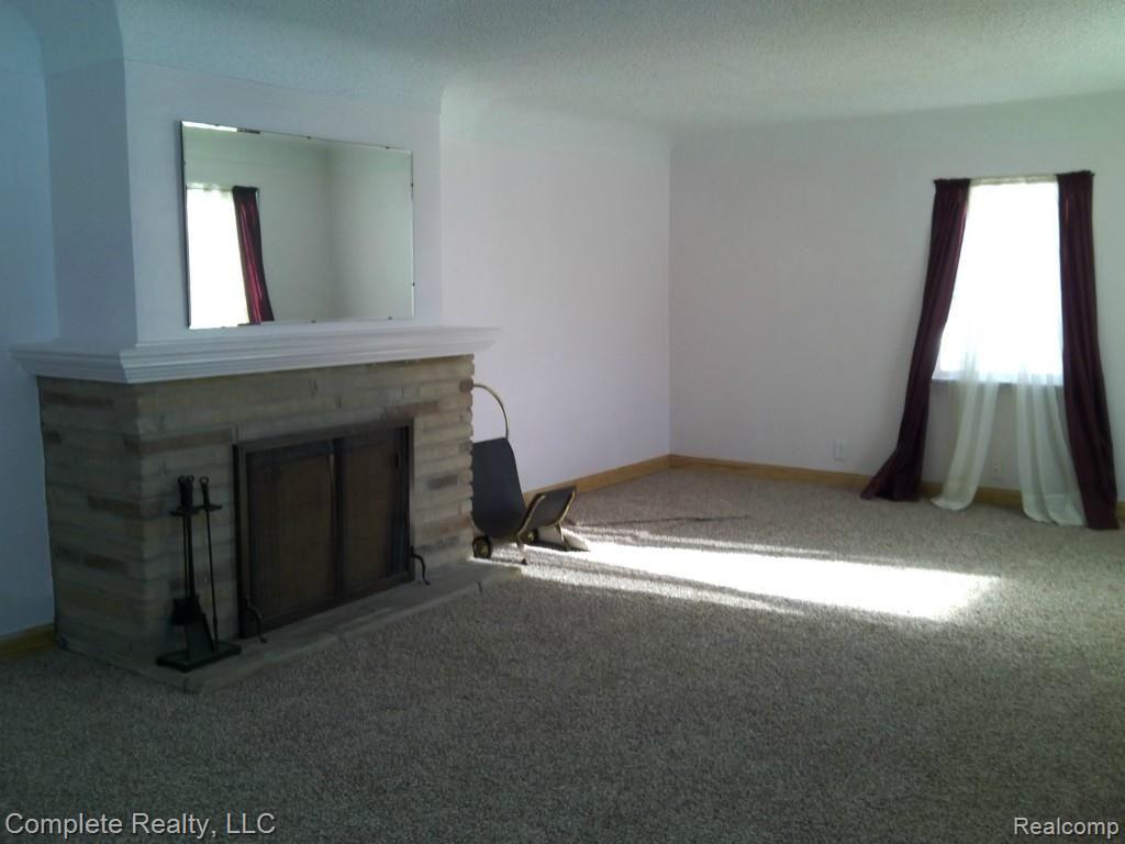 New Carpet throughout, Wood burning fireplace.