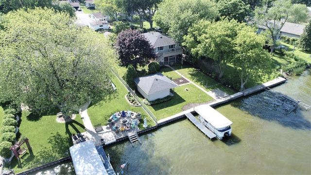 an aerial view of a house with yard swimming pool and outdoor seating