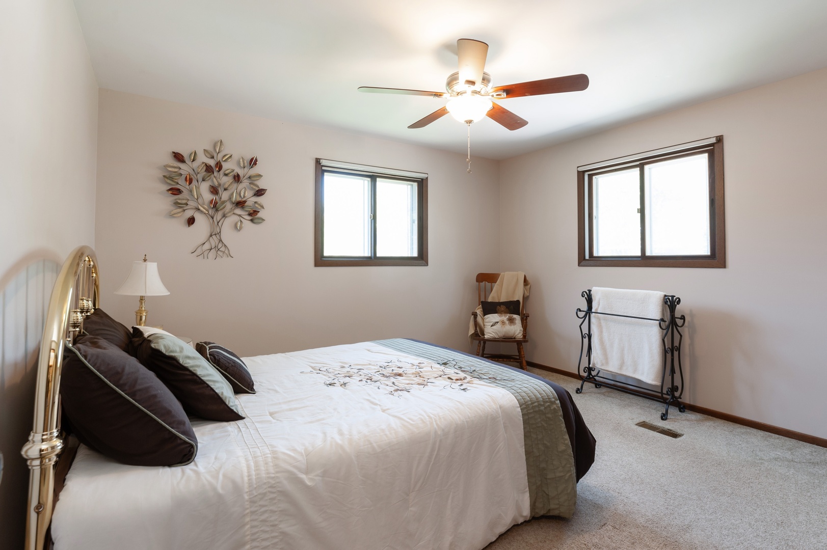 209 North Rushmore Road Fox Lake, IL 60020 - Photo 12 of 21 a bedroom with a bed and a chandelier