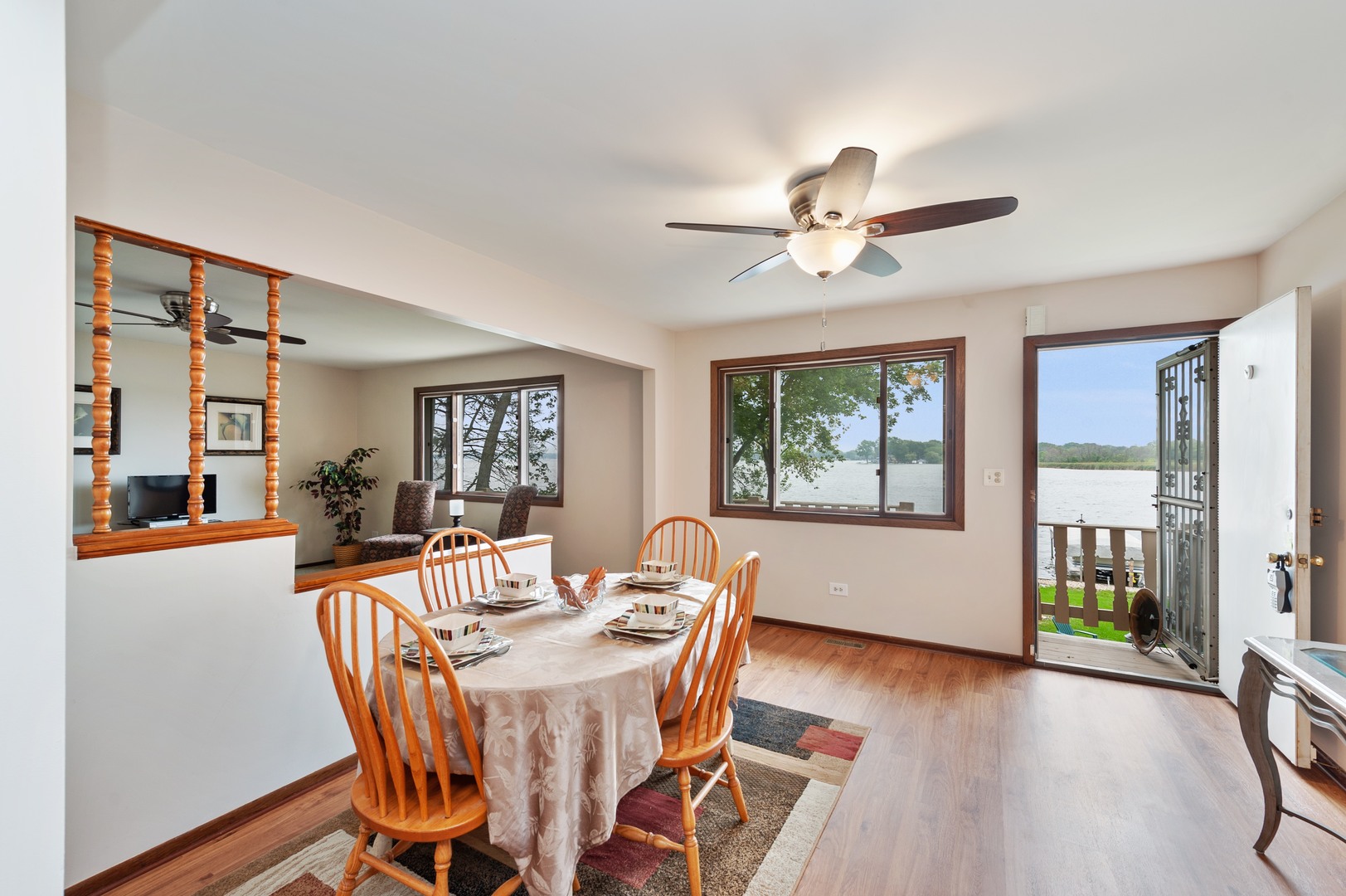 209 North Rushmore Road Fox Lake, IL 60020 - Photo 3 of 21 a dining room with furniture a chandelier and wooden floor