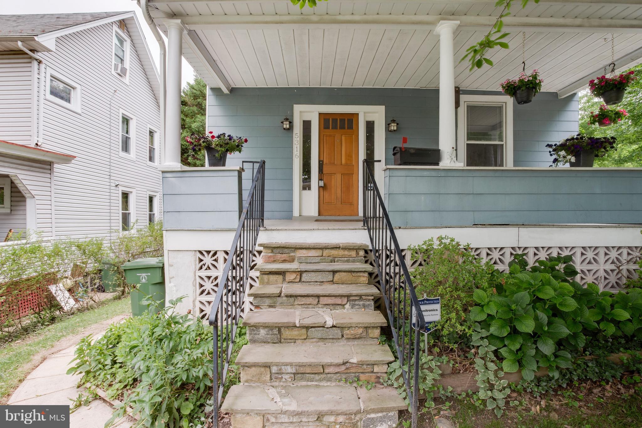 5316 Tramore Road Baltimore, MD 21214 - Photo 2 of 30 a front view of a house with potted plants