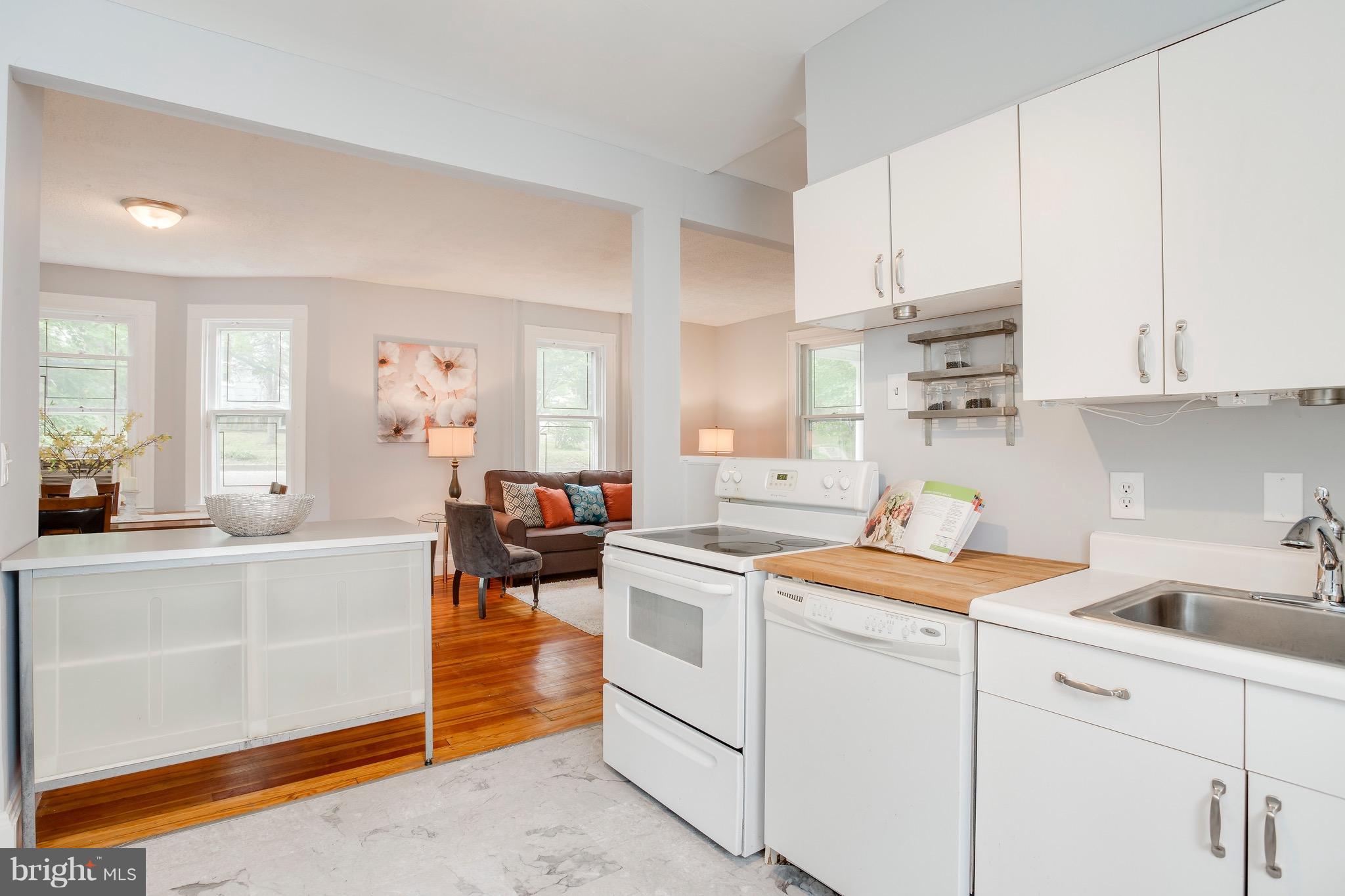 5316 Tramore Road Baltimore, MD 21214 - Photo 12 of 30 a kitchen with white cabinets and white appliances