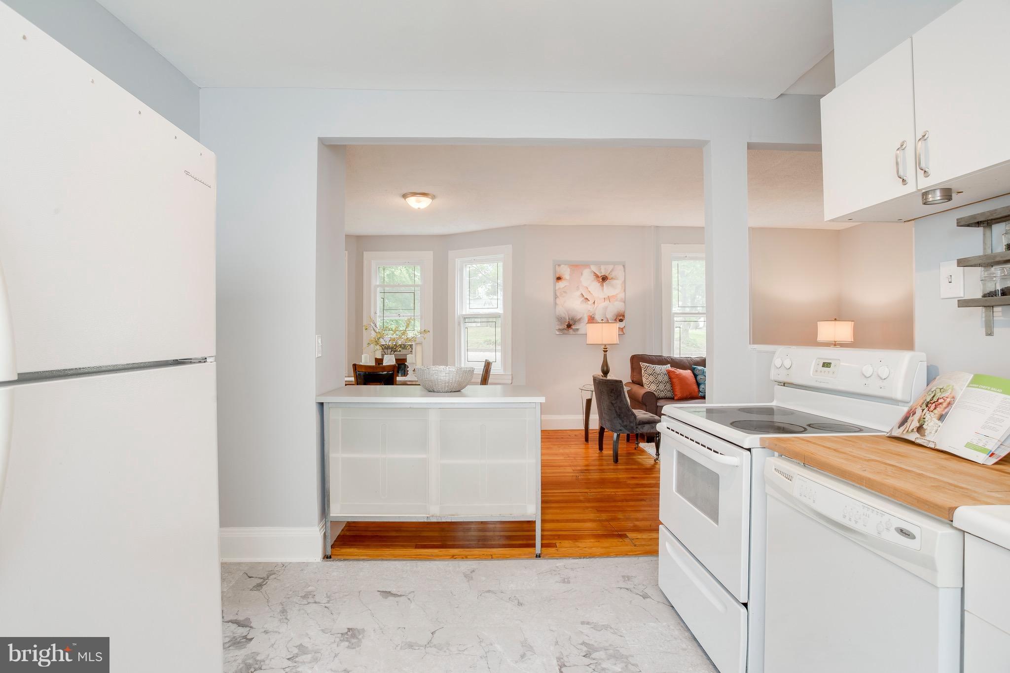5316 Tramore Road Baltimore, MD 21214 - Photo 13 of 30 a kitchen with white cabinets and sink