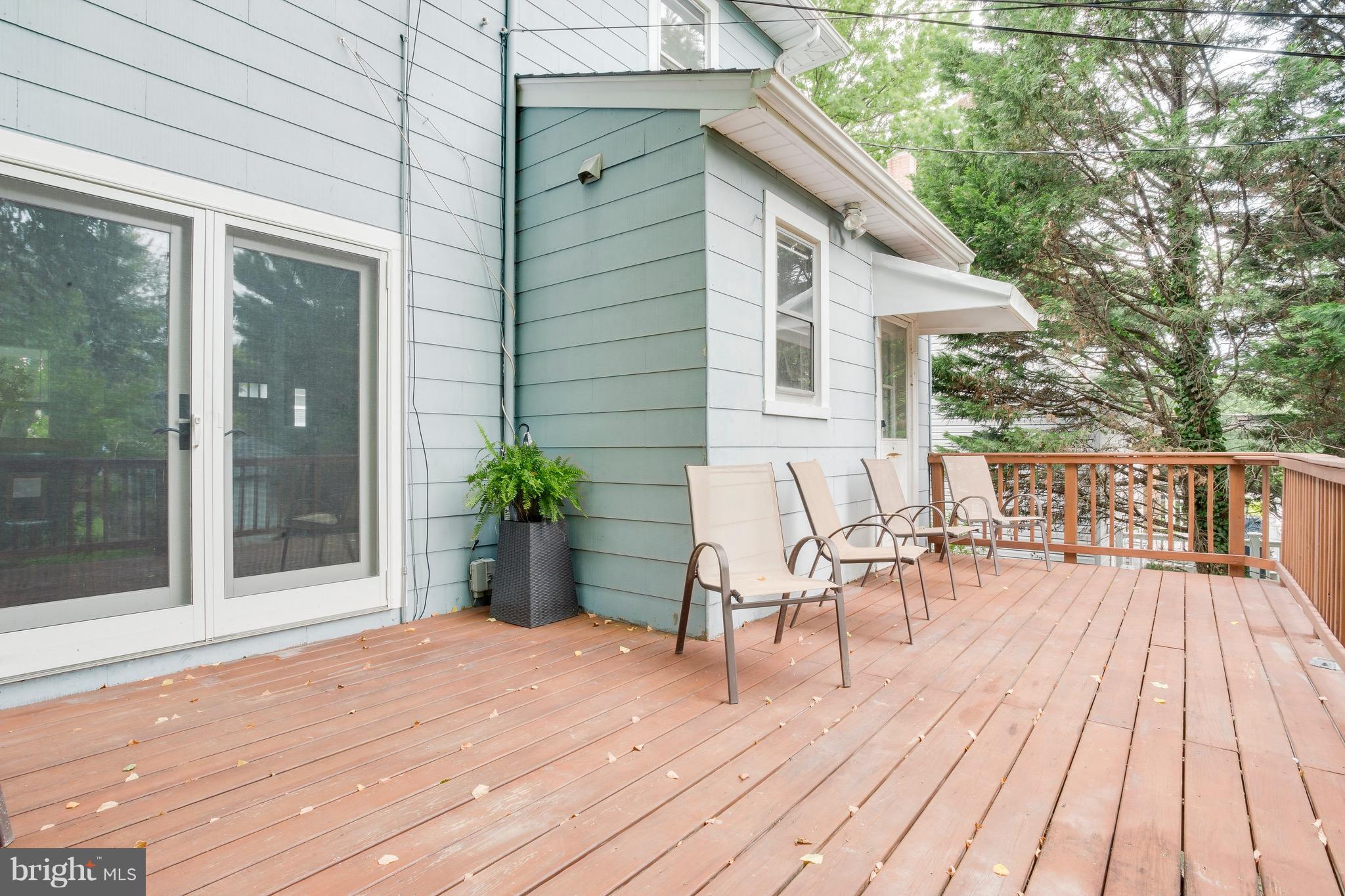 5316 Tramore Road Baltimore, MD 21214 - Photo 27 of 30 a balcony with chairs and wooden floor