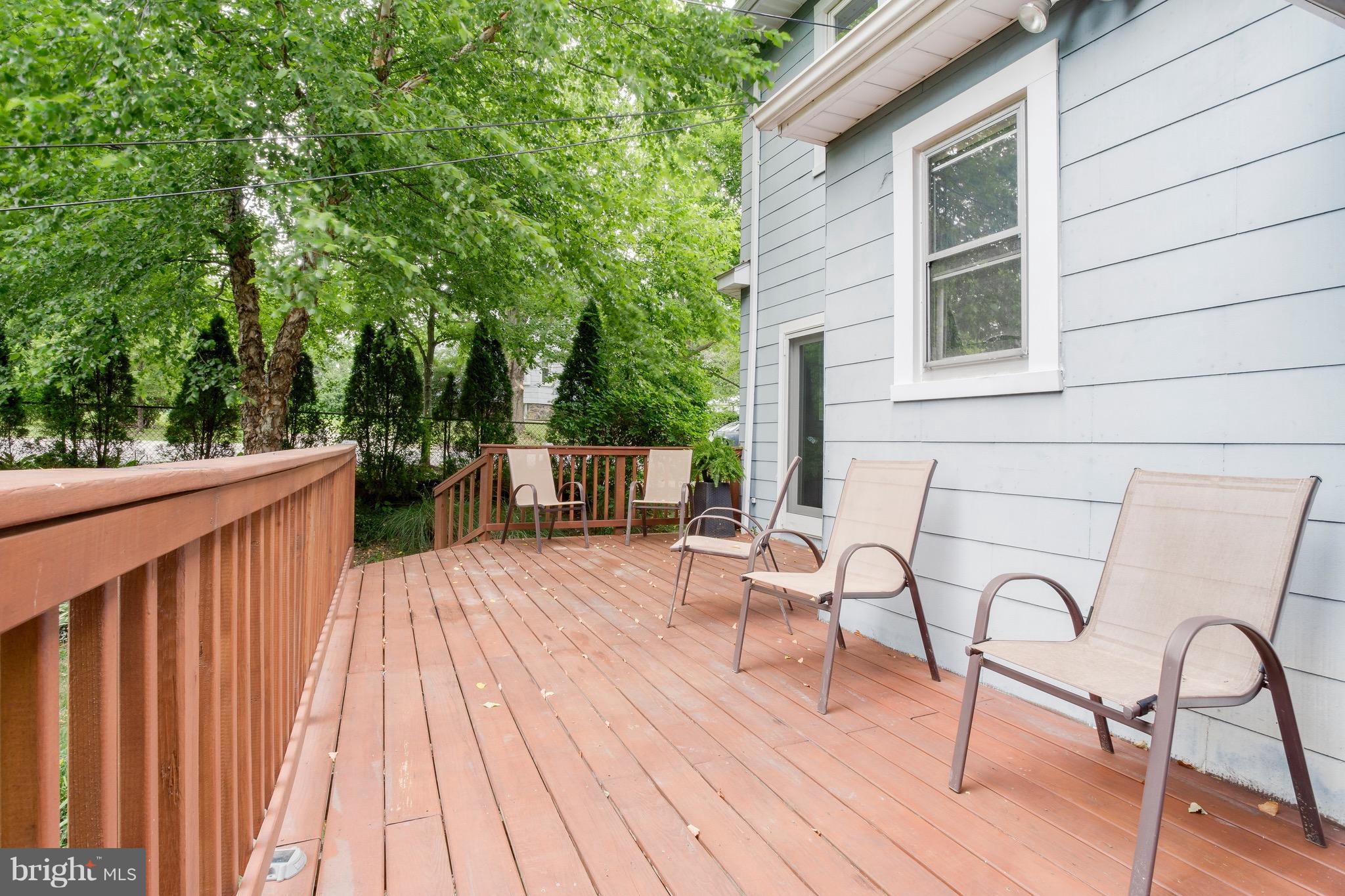 5316 Tramore Road Baltimore, MD 21214 - Photo 28 of 30 a view of table and chairs in patio with wooden floor