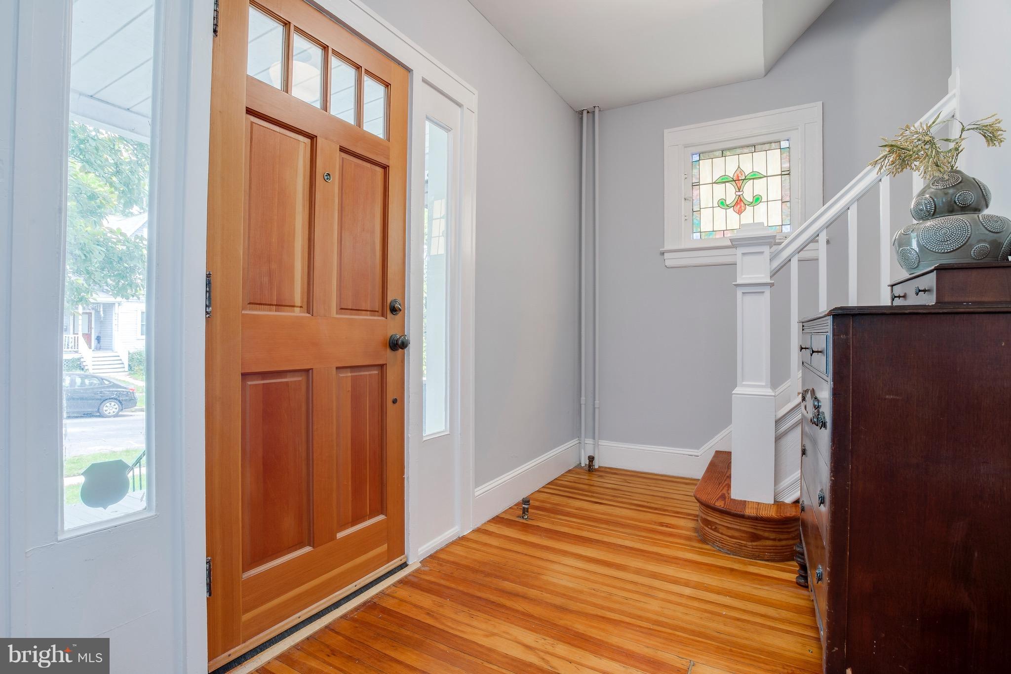 5316 Tramore Road Baltimore, MD 21214 - Photo 4 of 30 a view of empty room with wooden floor and fan