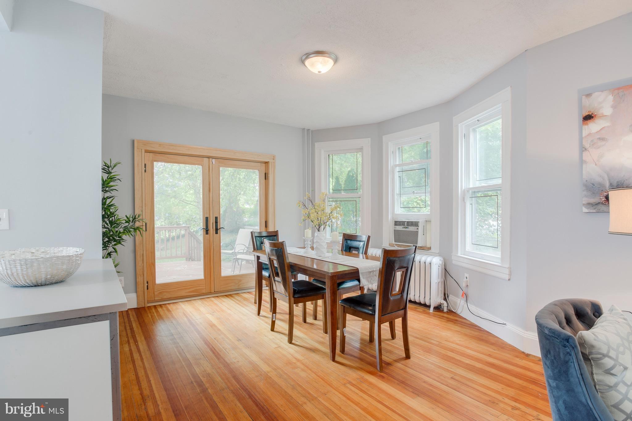 5316 Tramore Road Baltimore, MD 21214 - Photo 6 of 30 a view of a dining room with furniture and wooden floor