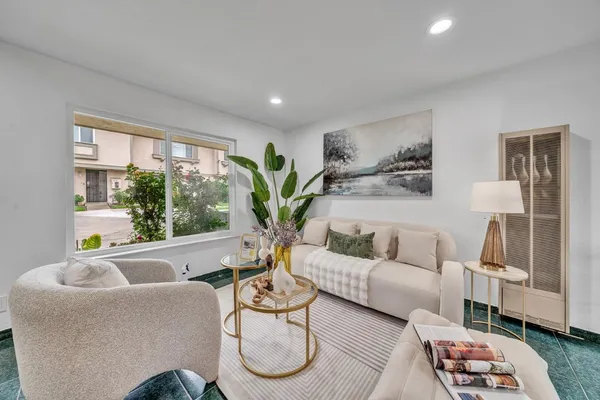a living room with furniture and a large window