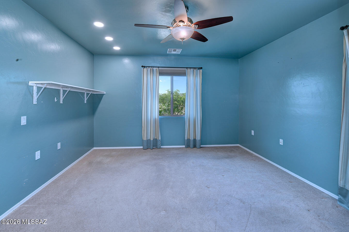 13991 East Cheavront Loop Vail, AZ 85641 - Photo 16 of 47 a view of an empty room with a window