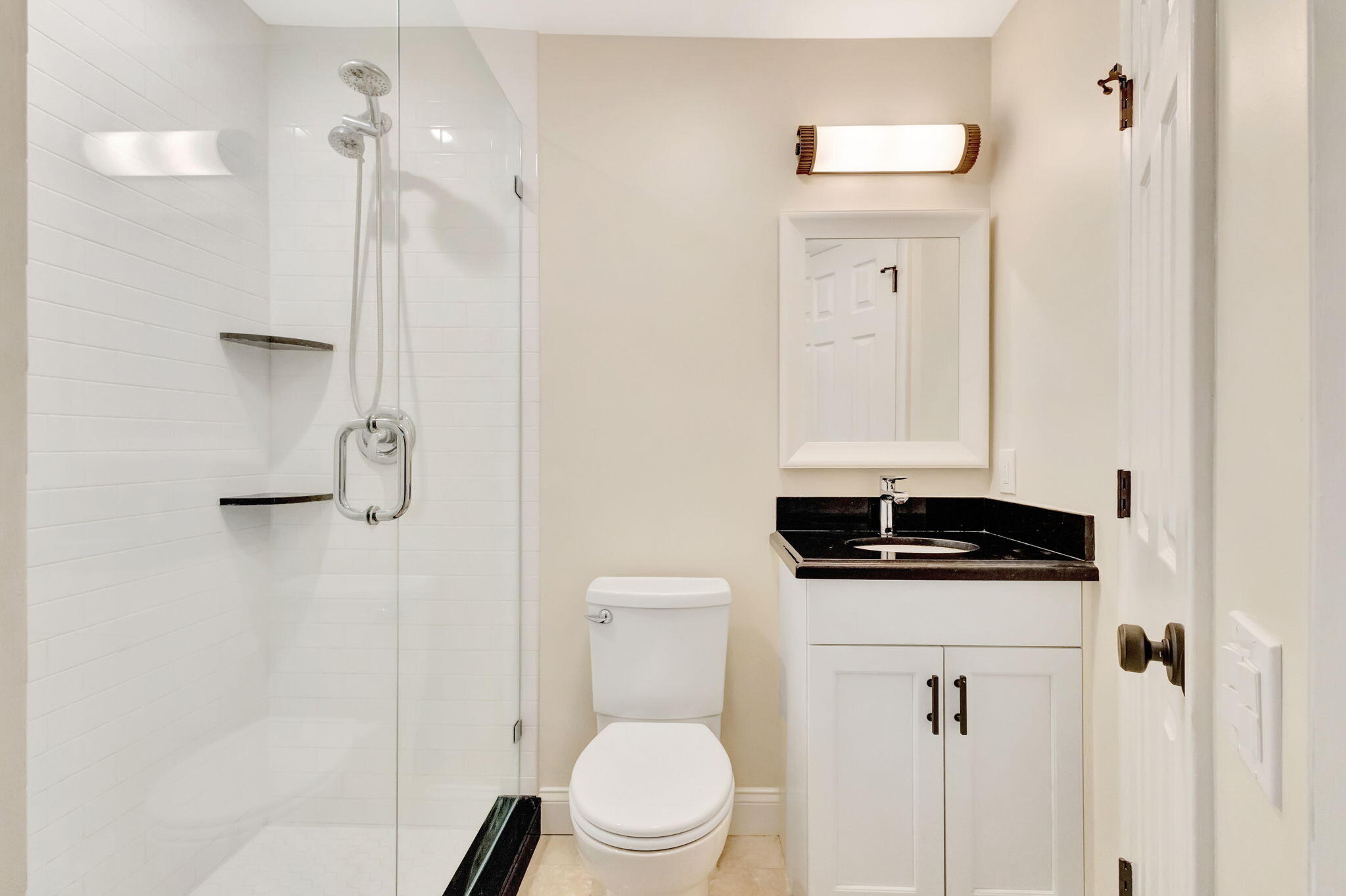 170 Celestial Way, Unit 83 Juno Beach, FL 33408 - Photo 12 of 70 a bathroom with a granite countertop sink a toilet and a shower