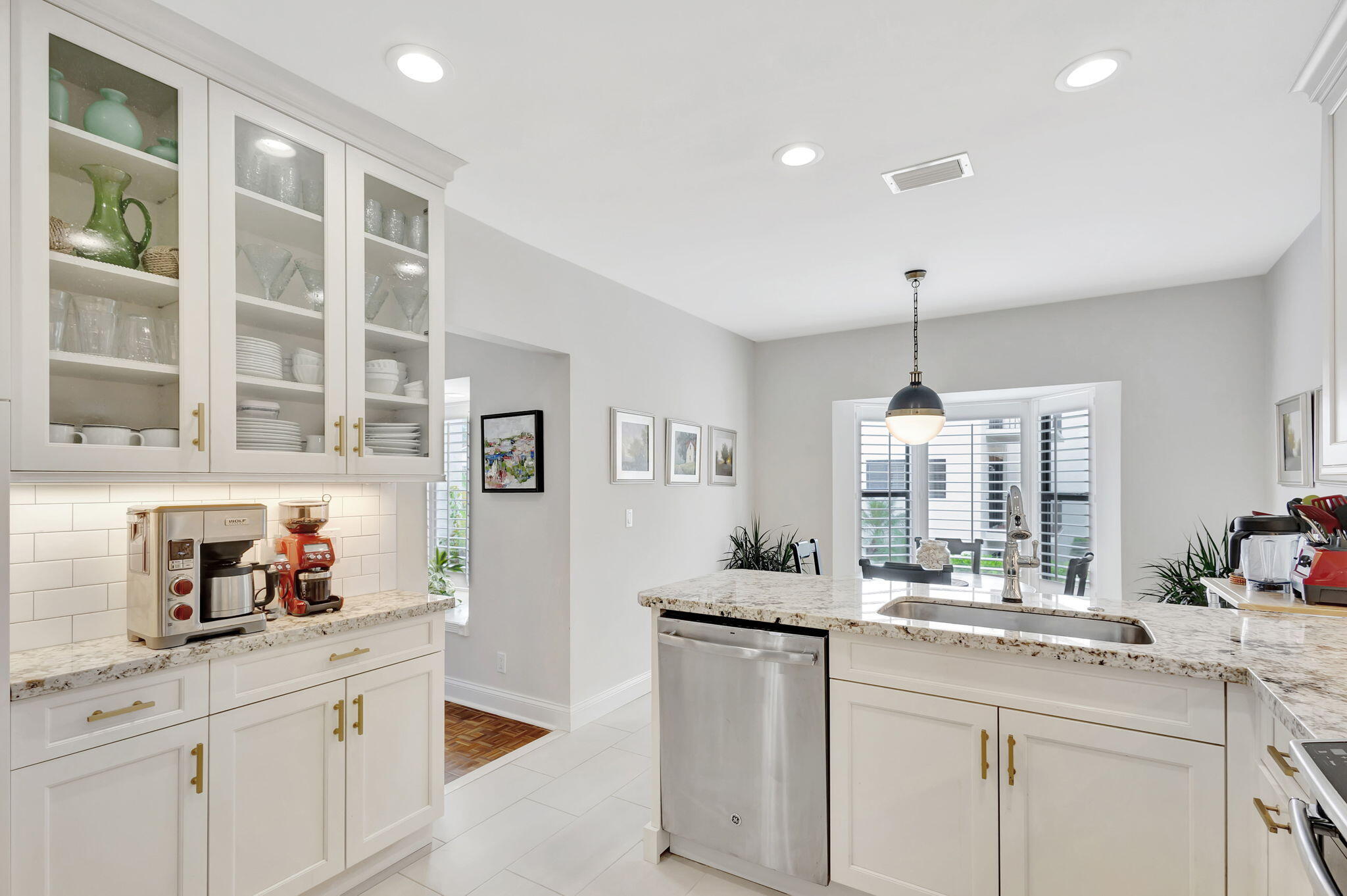 170 Celestial Way, Unit 83 Juno Beach, FL 33408 - Photo 22 of 70 a kitchen with stainless steel appliances a sink stove and cabinets