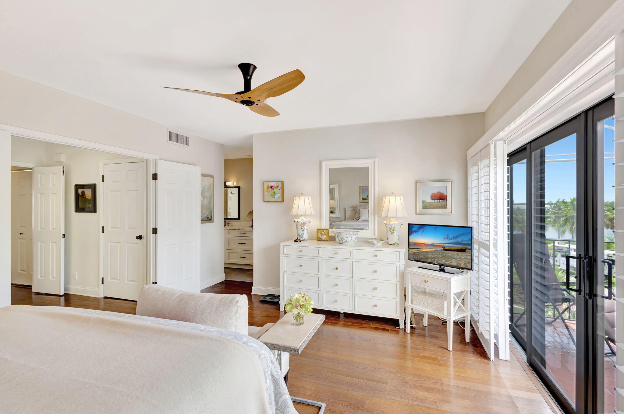 170 Celestial Way, Unit 83 Juno Beach, FL 33408 - Photo 30 of 70 a bedroom with furniture and a wooden floor