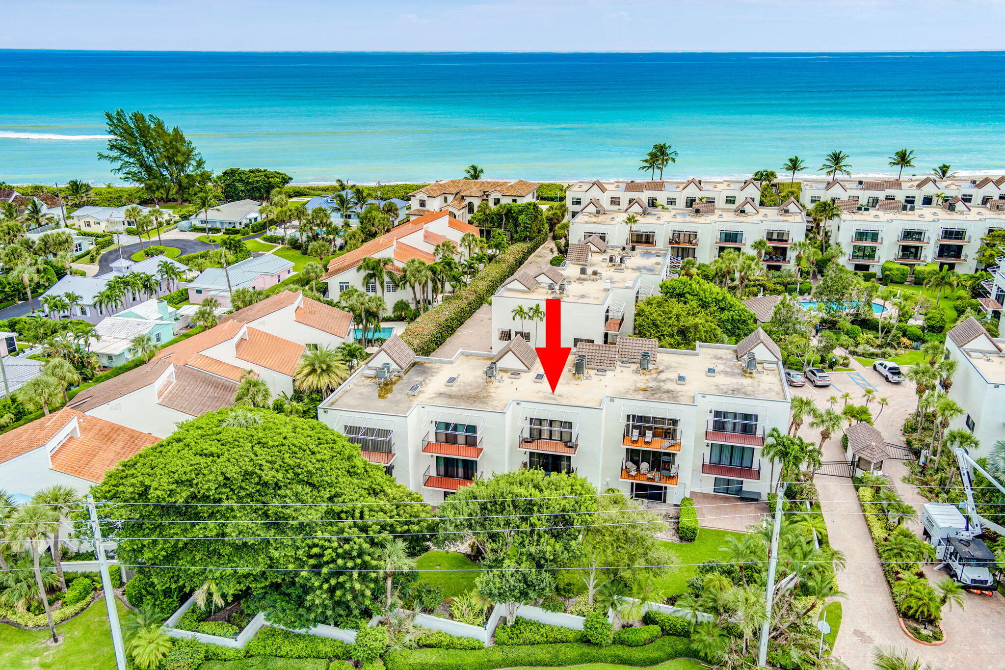 170 Celestial Way, Unit 83 Juno Beach, FL 33408 - Photo 67 of 70 view of building with an outdoor space and seating