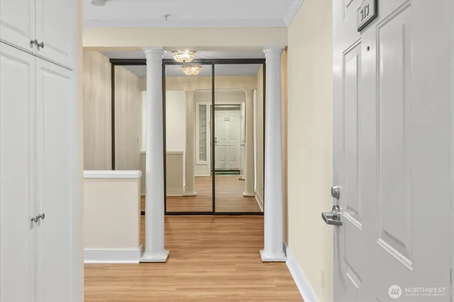 a view of a bathroom with a glass door shower and bedroom