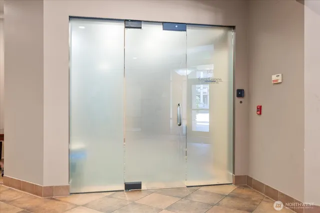 a view of a house with fountain couches and potted plants