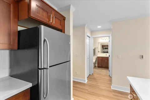 a view of a kitchen with a refrigerator