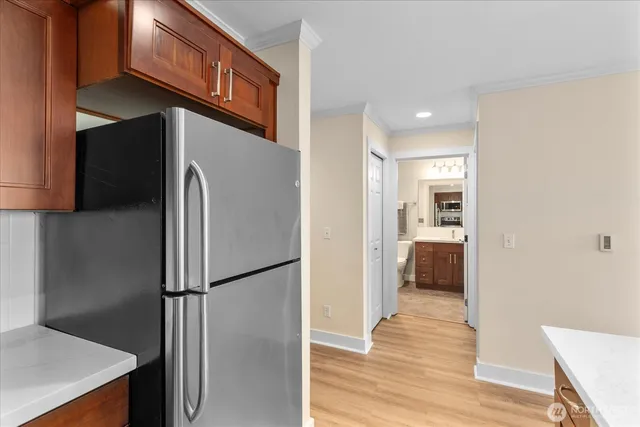 a view of a kitchen with a refrigerator