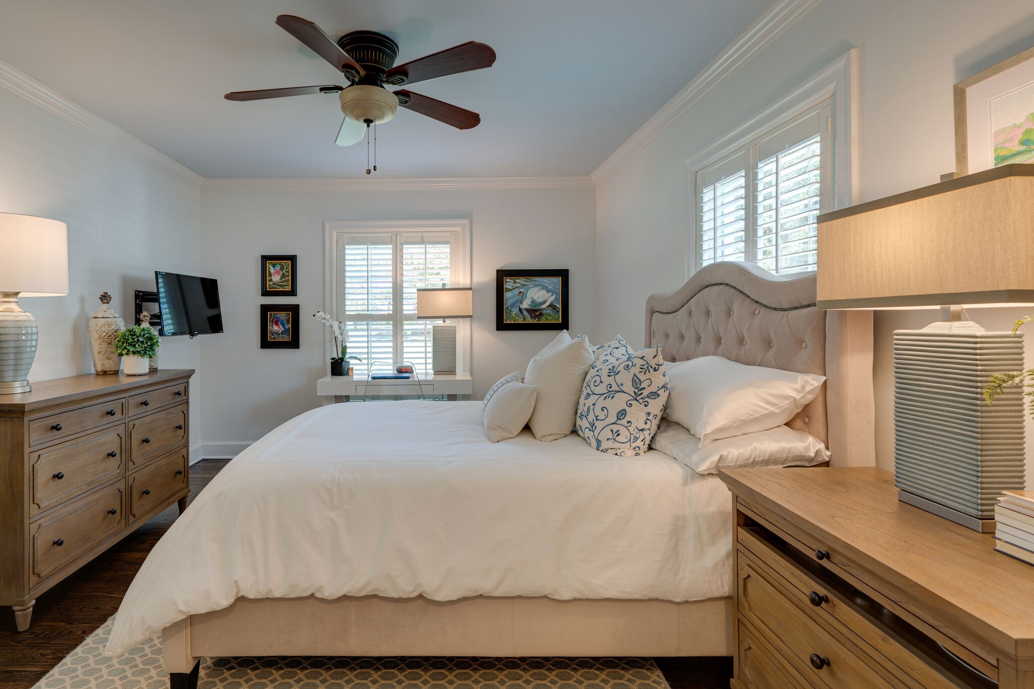 Undisclosed Address Nashville, TN 37204 - Photo 15 of 24 a bedroom with a bed and dresser with mirror