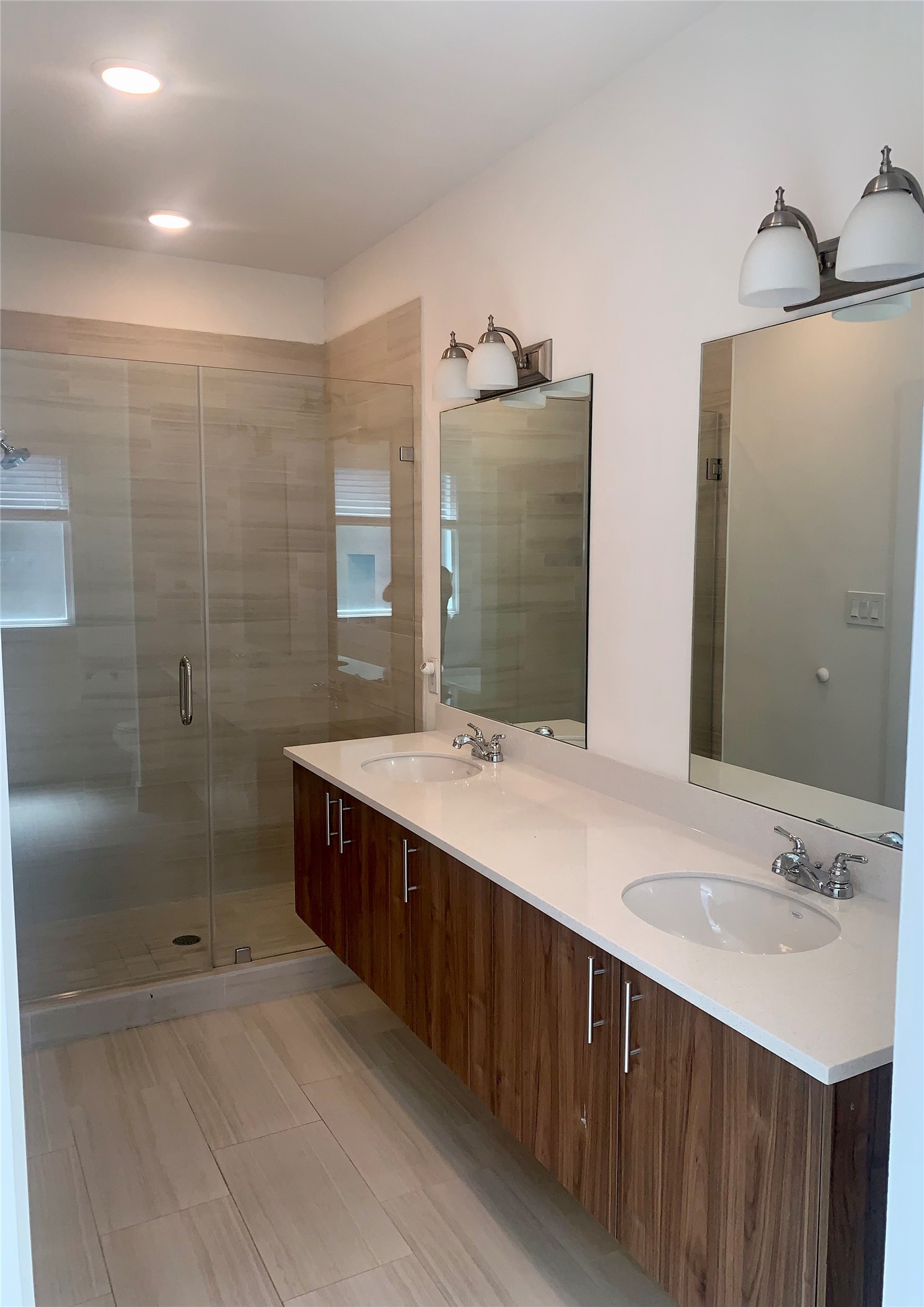 10209 Las Nubes Avenue Houston, TX 77075 - Photo 16 of 29 a bathroom with a double vanity sink mirror and shower
