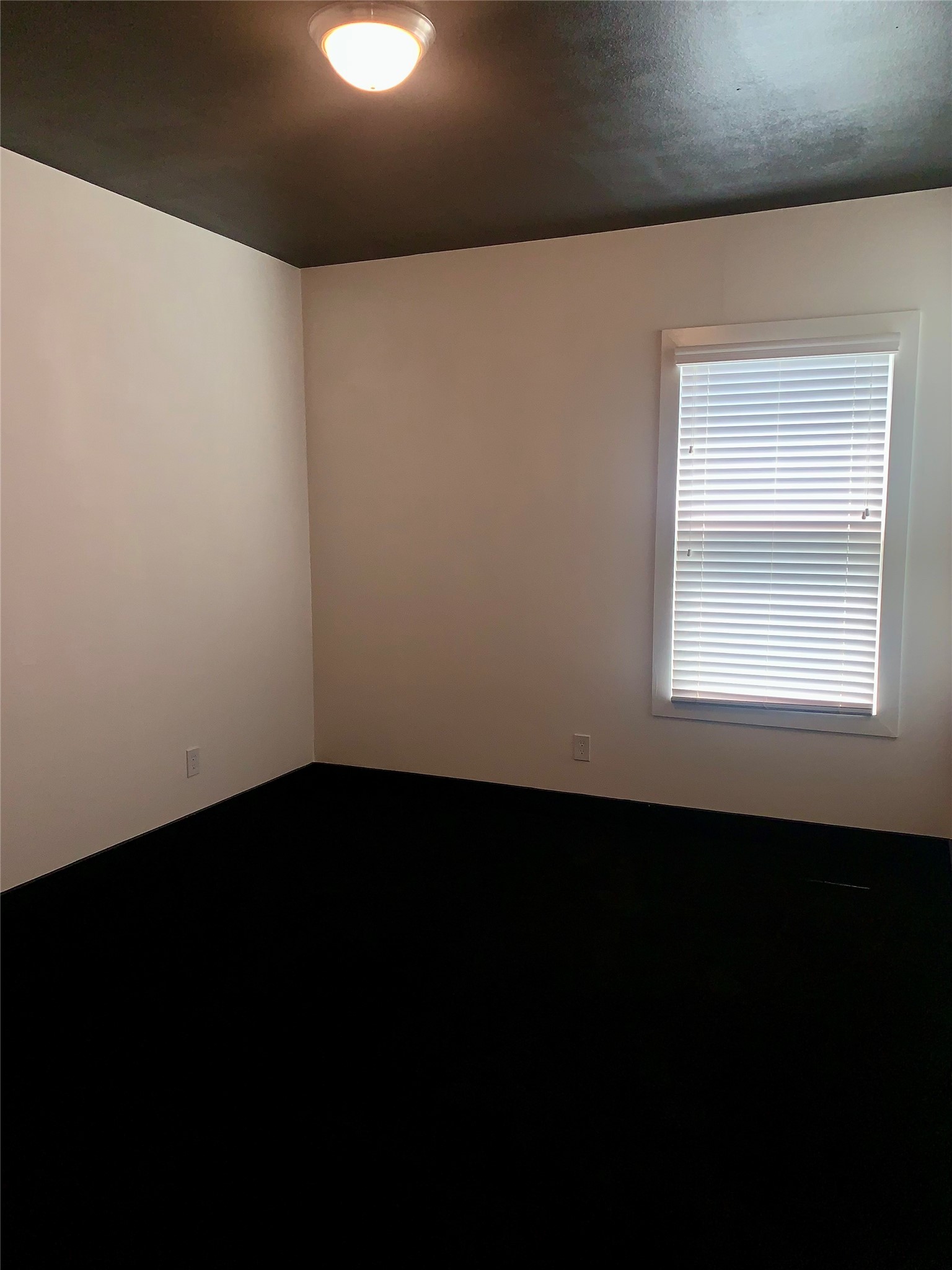 10209 Las Nubes Avenue Houston, TX 77075 - Photo 22 of 29 a view of an empty room with wooden floor and a window